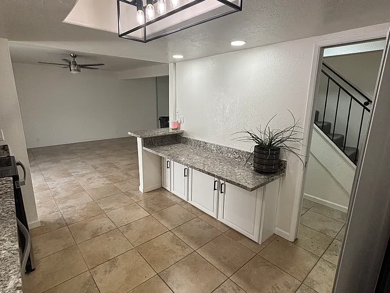 Modern lighting and extra storage under breakfast counter