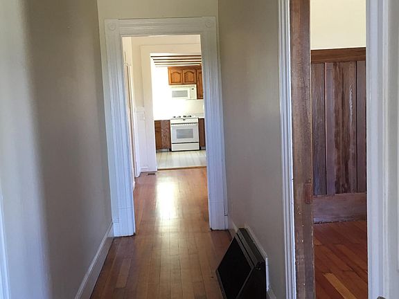 Continue walking into front hallway to 1st bedroom, kitchen