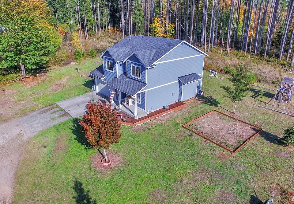 Shy of an acre dead end, private road aids in privacy.