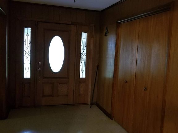 Large Entry with storage; opens to formal living room/dining room