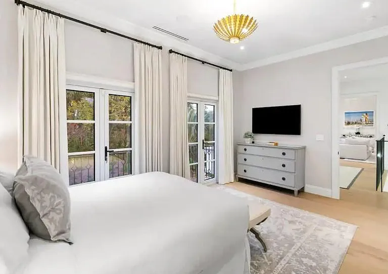 Guest bedroom with balcony for scenic views