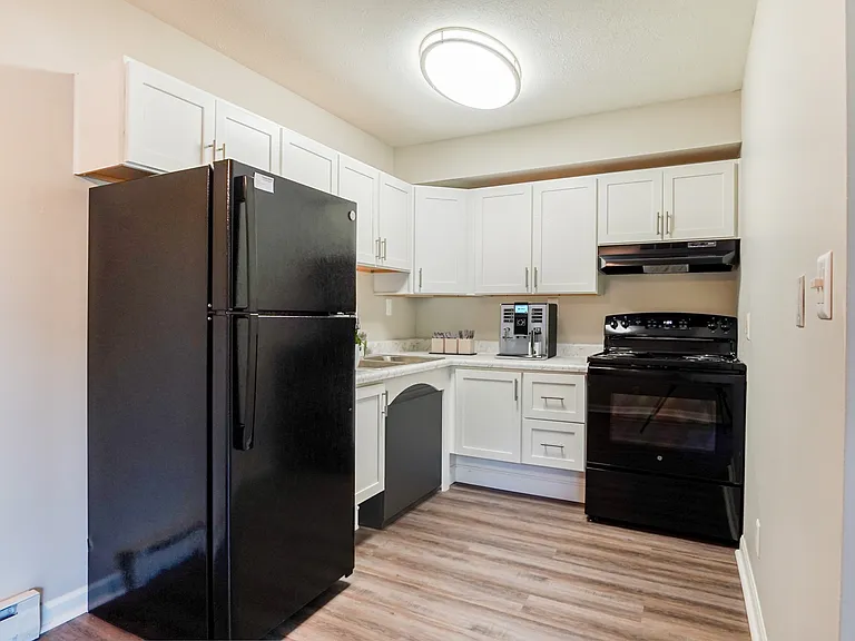 Elevate your living at Green Valley. This beautifully designed kitchen features modern appliances and ample storage, blending functionality and style. Make this inviting space your own today! Schedule a tour to see your future home.