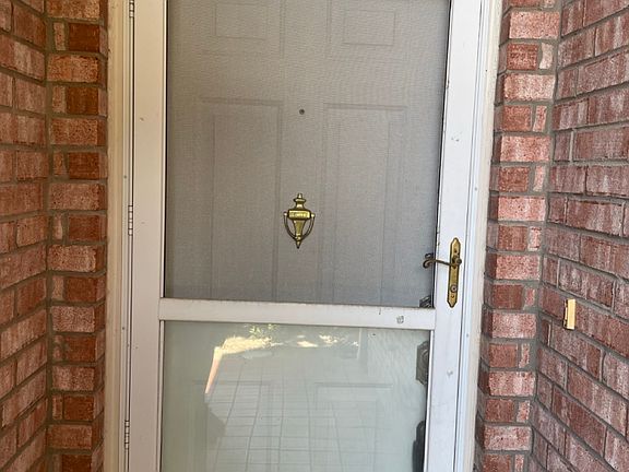 Locking front storm door. Peep hole in front door.