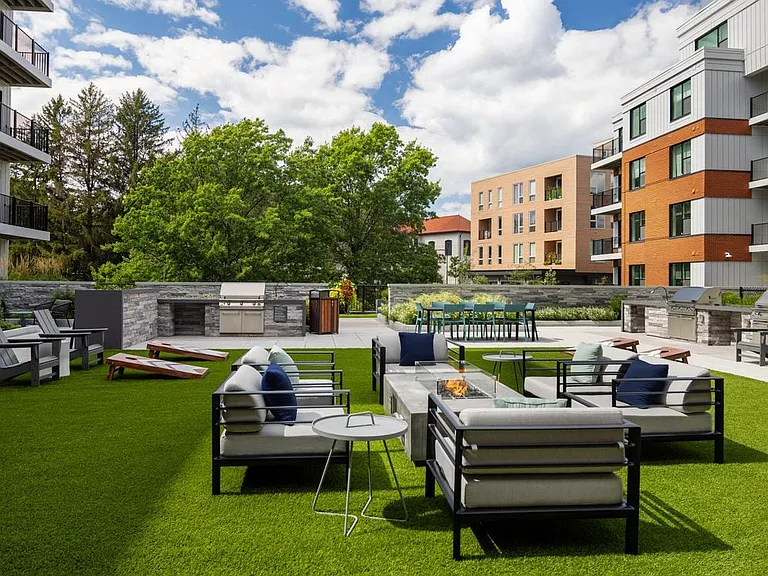 Outdoor lounge seating with firepit and grill area