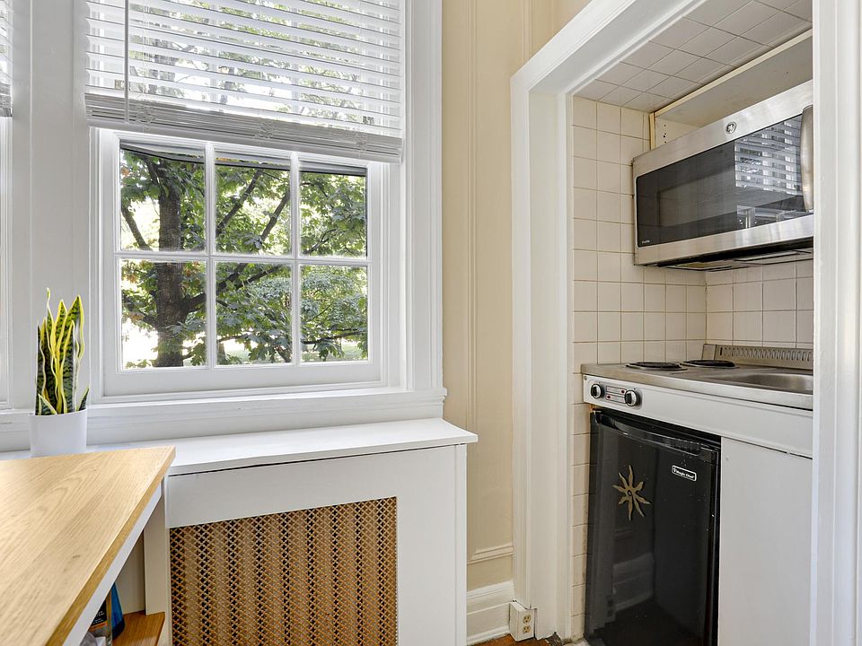 Kitchen station two burners, microwave and small refrigerator.