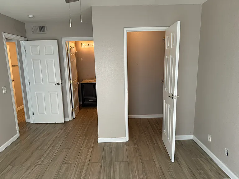 Lighted closets in guest bedroom room.