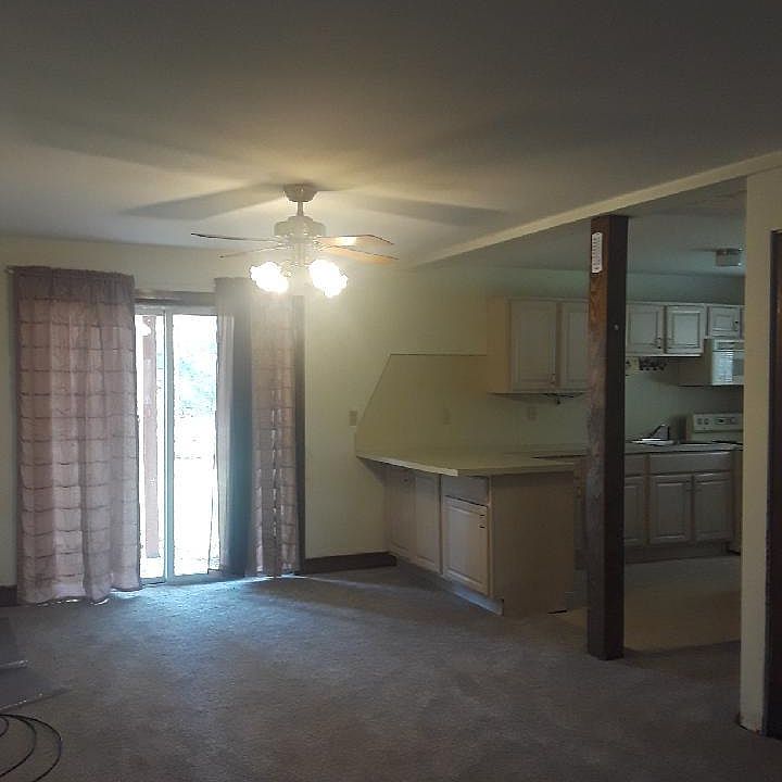 Dining room area that oversees into spacious kitchen. Sliding glass door also leads into backyard.