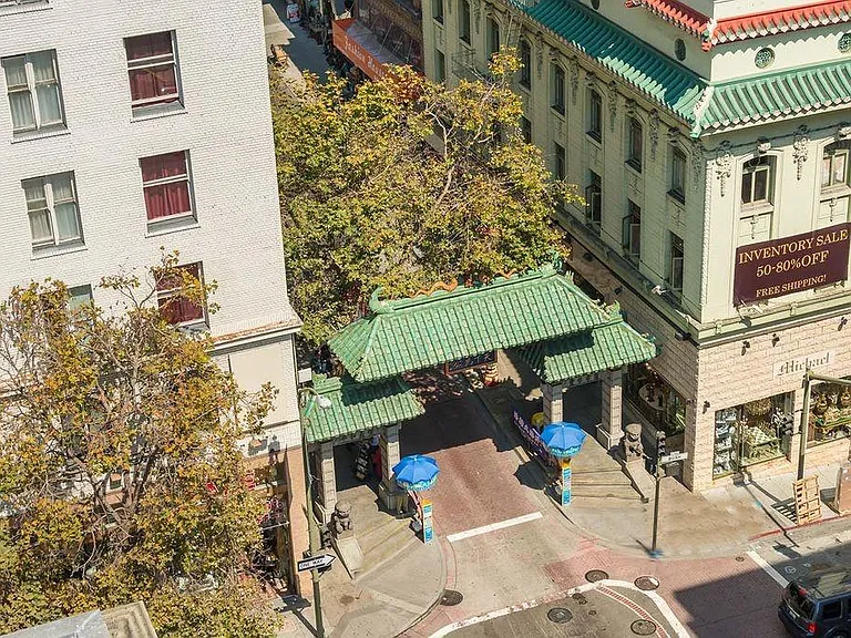 Building is nestled next to the entrance to Chinatown, the f