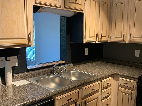 Kitchen, passthrough opening to living area