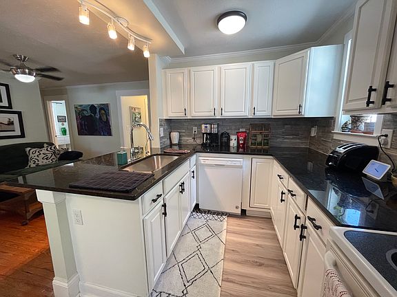 Kitchen - granite counter tops, stainless steel fridge, garbage disposal, fully stocked pantry