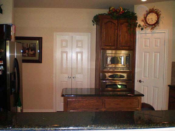 Kitchen w/SS Appl. Granite, Tile Floor and Tile Backsplash