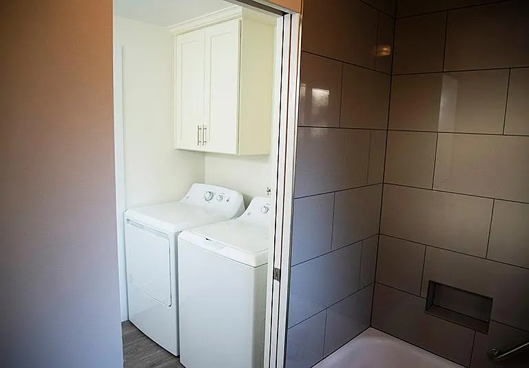 Brand new washer and dryer with cabinet for laundry supplies