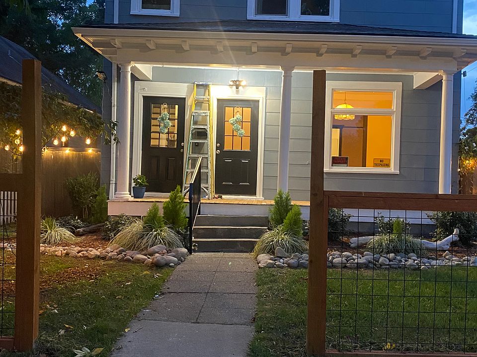 Front of house at night. The downstairs unit is available for rent (the unit with the lights on). This a very large one bedroom