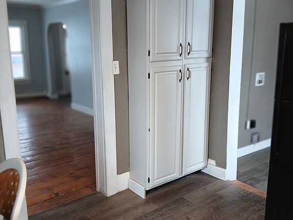 Kitchen with pantry, adjacent laundry mud room with laundry hook up. New kitchen quality luxury vinyl plank flooring