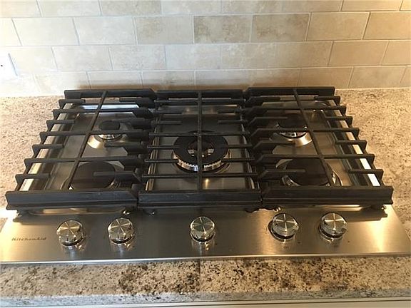 5-burner KitchenAid gas cooktop.