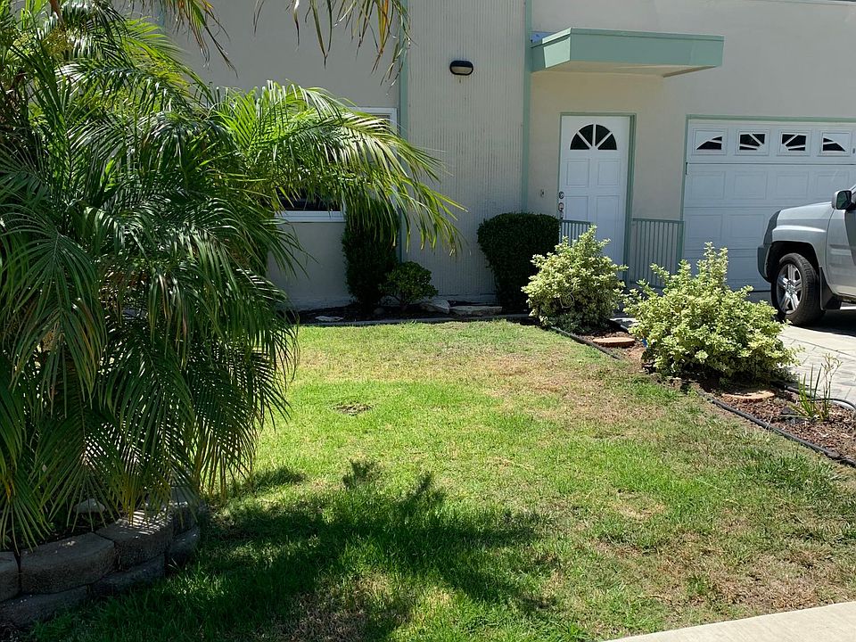 front unit #1 grass front yard, 1 car parking in left side of garage & 1 tandem