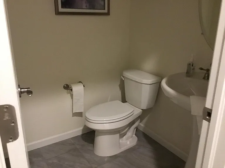 powder room on main floor just off garage area