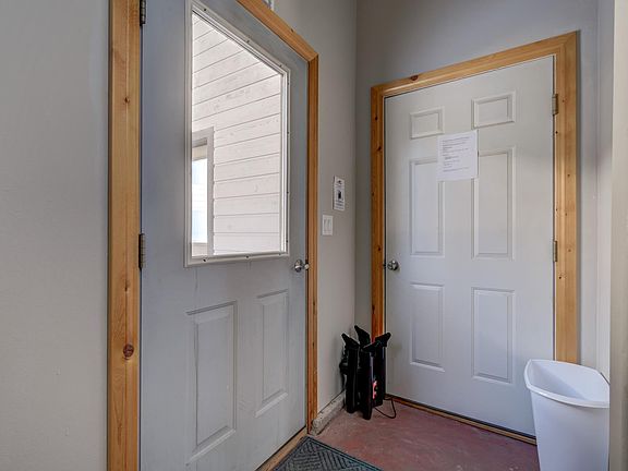 Entrance to apartment with boot warmer, ski storage