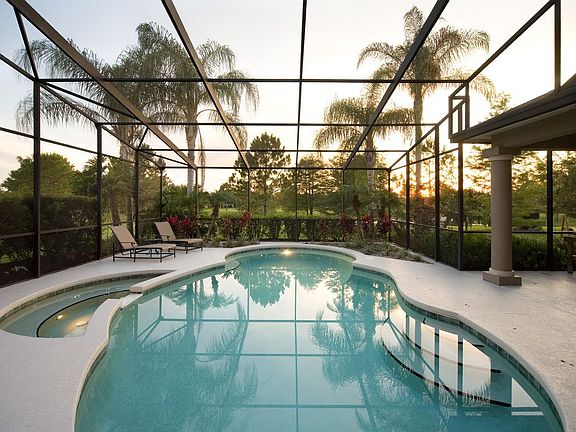 True Florida lifestyle with pool and spa located on this pond frontage lot!