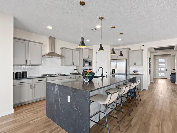 The Parklane kitchen features tons of storage with cabinets throughout and a spacious corner pantry.