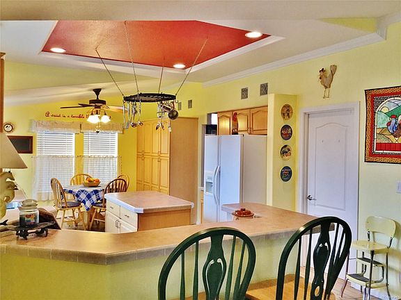 Large breakfast bar, eat-in kitchen, lots of cabinet storage and all all appliances included.