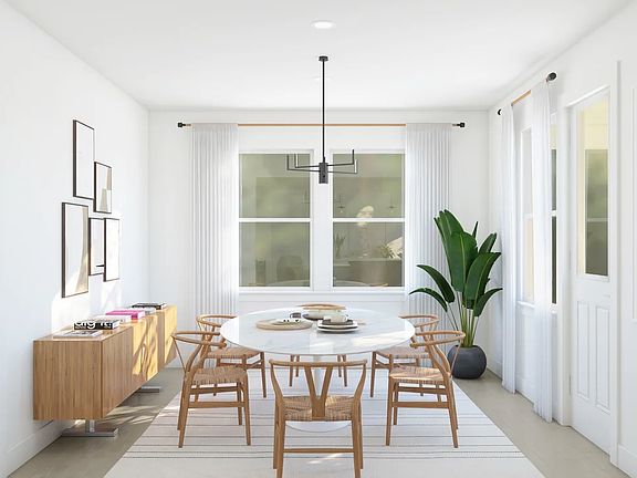 Dining area with chandelier adjacent from kitchen
