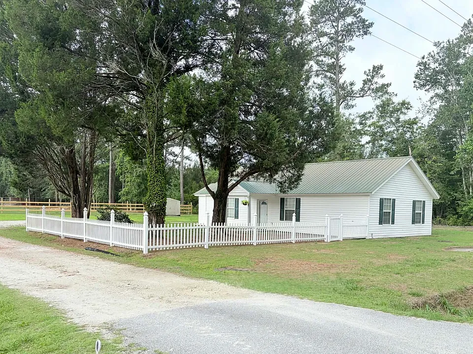 Charming country home for rent near beautiful Lake Moultrie. The unfinished home offers comfortable living space and a peaceful rural setting perfect for those seeking quiet country living.