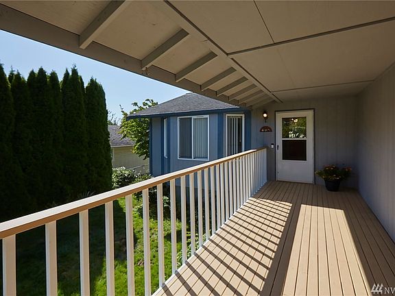 Welcome Home! Covered Porch Greets You & Yours. Perfect For Sitting & Watching The World Go By. Please Note: Ring Doorbell Does Not Convey; Seller Will Replace With Another Doorbell
