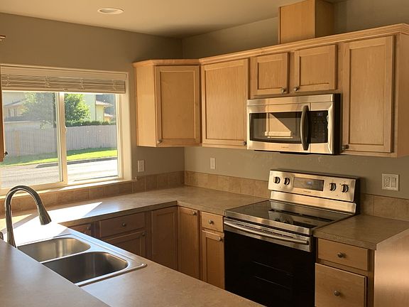 Kitchen with stainless steel appliances and a south facing window
