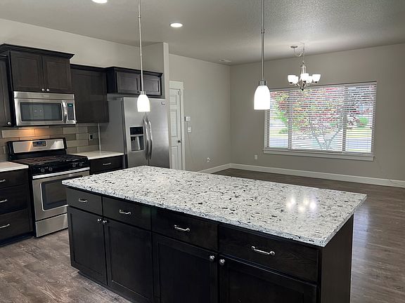 large kitchen, large dining room ,all quartz countertops, and stainless steel appliances