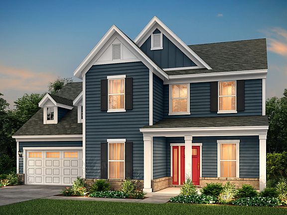 Northridge Exterior LC2G features siding, brick, covered front sitting porch and 2 car garage