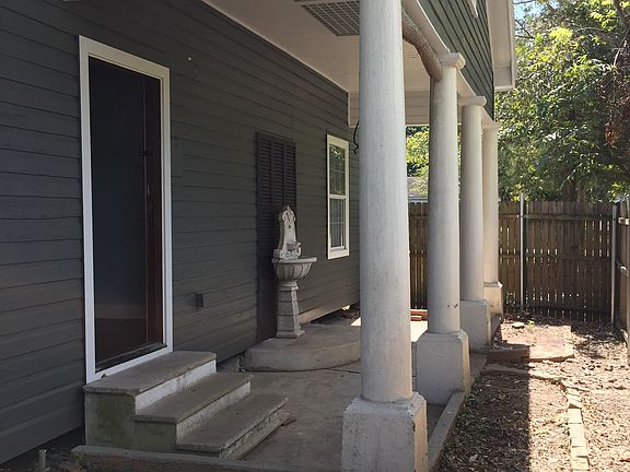 Side porch with entrance to Master Bedroom