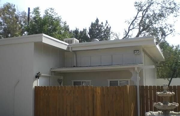 Front of guest house with privacy fence