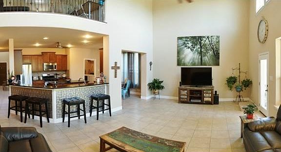 Very large living area, off the open kitchen area with large sit around bar! This home is a great en