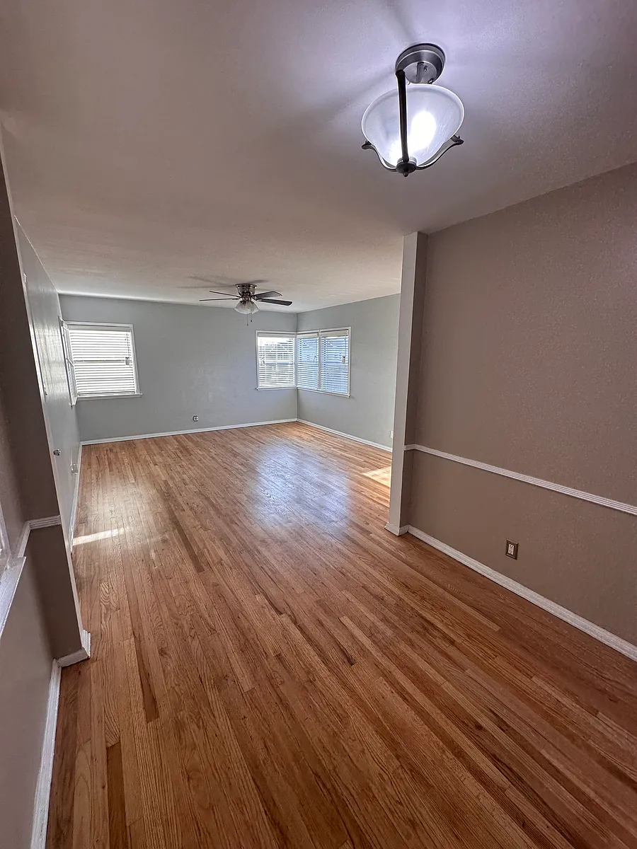 Living Room with the original hardwood floors. - 4202 Menlo Ave