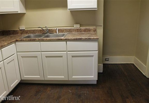 VIEW OF KITCHEN FROM DINING ROOM