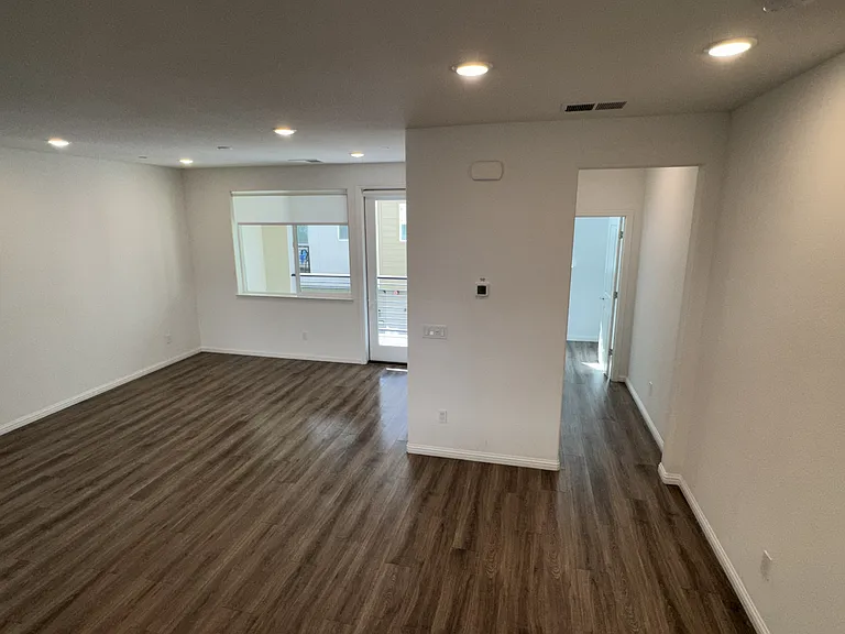 Living Room & Hallway to Washer/Dryer & 2F Half Bath