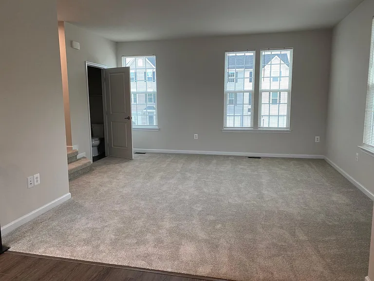 Living room, half bath - kitchen view