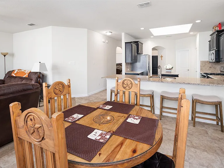 The pictures were taken while the home was occupied. None of the furniture is included with the home.
