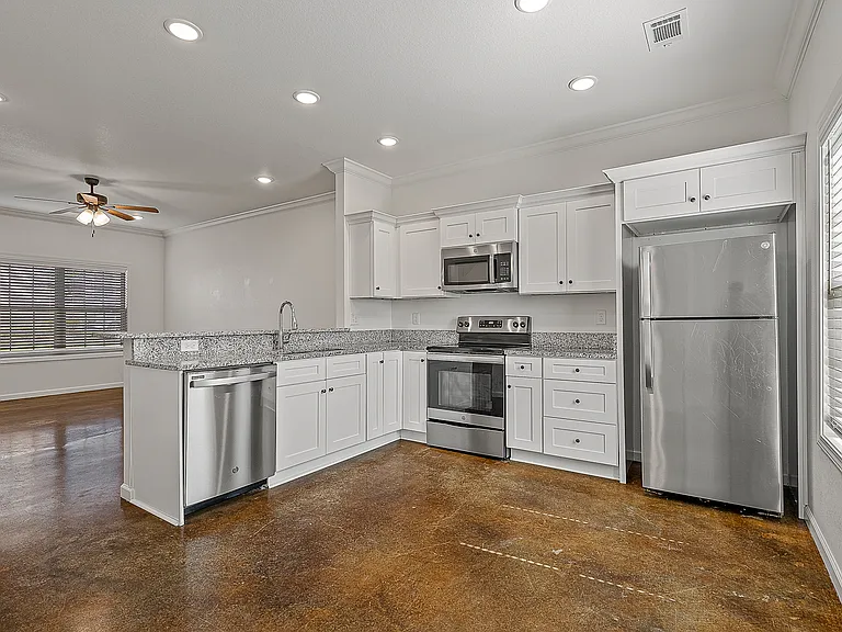 Living Room + Kitchen | The Brook Townhome | Deerfield Crossing II | 2 bed 2 bath