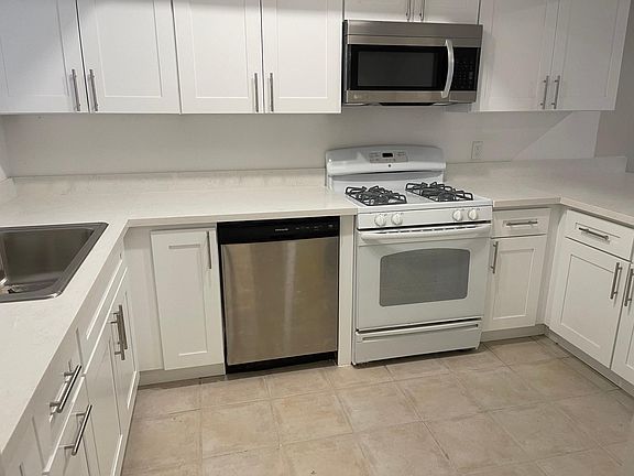 Kitchen with white shaker cabinets.