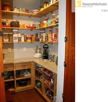 Butler pantry with marble countertop.