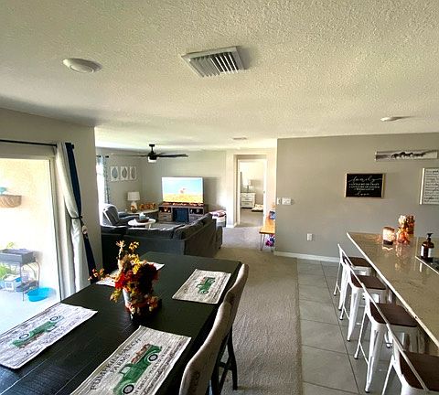 Looking Towards Dining, family room & entry to Master BR