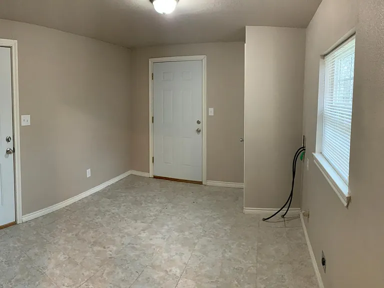 Large utility room with garage access.