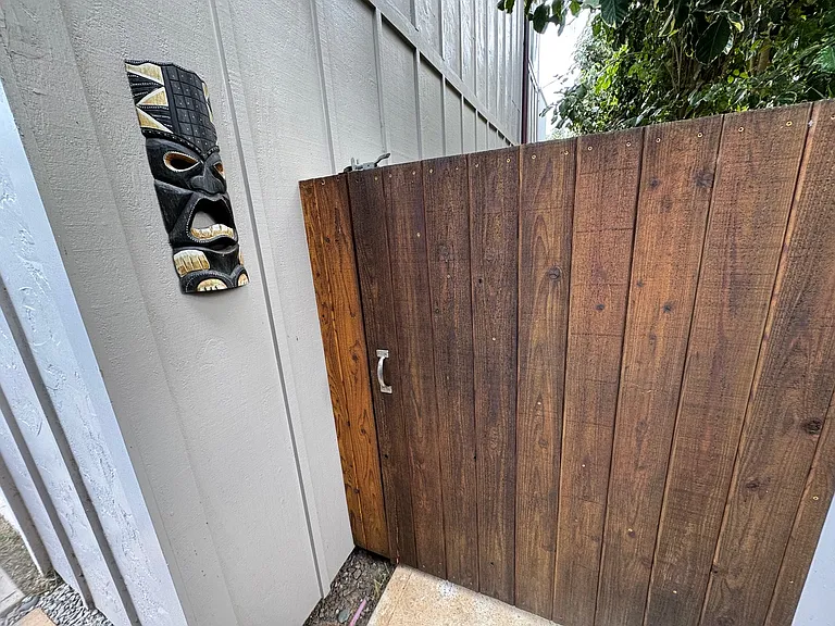 Privacy gate for your use only. Leads to the hot/cold shower, grassy yard & entry stairs.