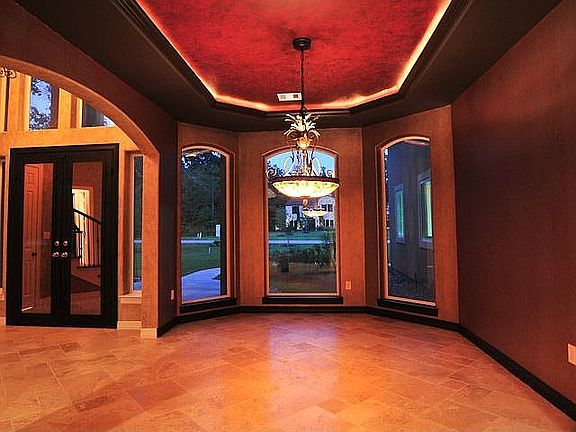 View of the formal dining room with lighting featured in the tray ceiling.