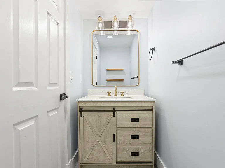 Downstairs hallway half bathroom.