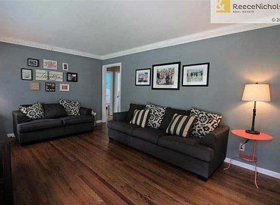 Welcoming Sunlit Living Room With Hardwood Floors