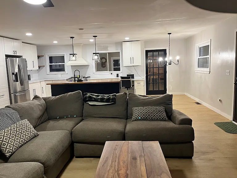 Open concept living room/kitchen with breakfast bar and small dining area. Formal dining in a private separate area.