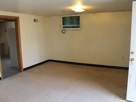 Living room with door going into kitchen